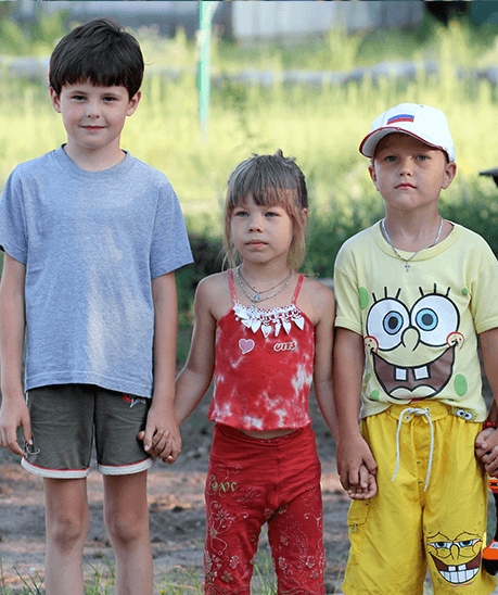child 1 a group of children holding hands