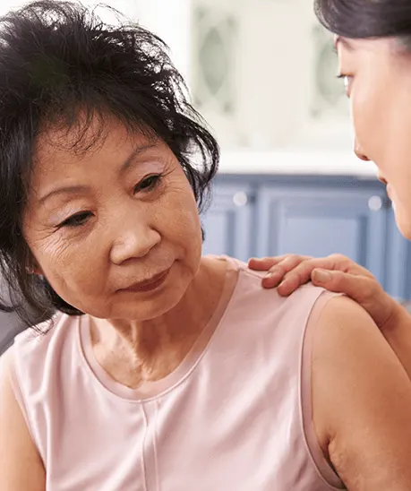 a woman looking at another woman