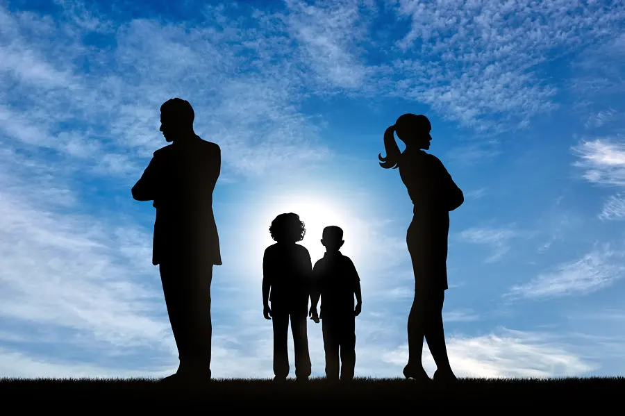 a silhouette of a broken family